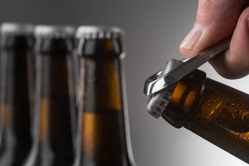 Opening a bottle of beer