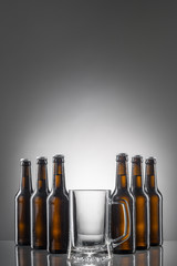 Six beer bottles and cup