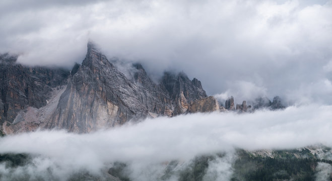 Mountain panorama in the Dolomite Alps, Italy. Mountain ridge in the clouds. Beautiful landscape at the summer time