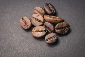 Close up of coffee beans are the background.