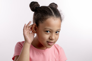 adorable nice black-haired girl is beiing checked her hearing in the hospital. acute, deffective,...