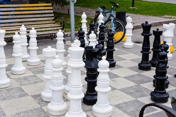 Chess Pieces Board Outdoors Squares Park Large Strategy Asphalt. Giant chess on the asphalt. Ulyanovsk, Russia.