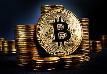 Bitcoin BTC and stacks of coins. Crypto stock exchange concept.