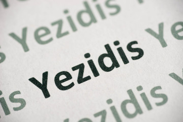 word Yezidis  printed on paper macro