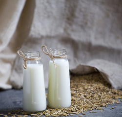 Oatmeal in bottles and oats in a bag