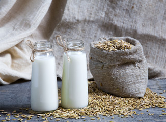 Oatmeal in bottles and oats in a bag