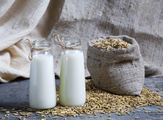 Oatmeal in bottles and oats in a bag