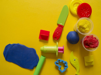 child mold from colored plasticine.Children's hand