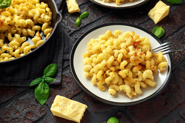 Homemade baked macaroni and cheese with cheddar served on plate