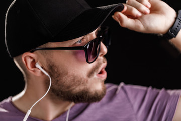 the man listening to music in headphones