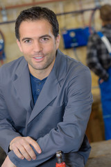Fototapeta premium mechanic posing in workshop