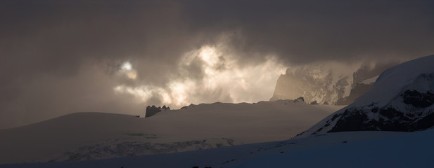 Dramatic dark stormy sky over Mt. Elbrus slope.