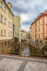 Colorful houses, Certovka (the Davil's Stream), Kampa Island, the railing is decorated with the locks of love, Prague
