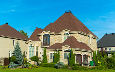 Luxury house in Montreal, Canada against blue sky