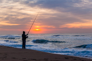 Fishing Silhouetted Beach Ocean Sunrise