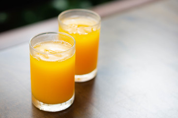 Closeup orange juice on wood table, drink for healthy concept, selective focus
