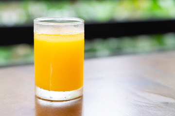 Closeup orange juice on wood table, drink for healthy concept, selective focus