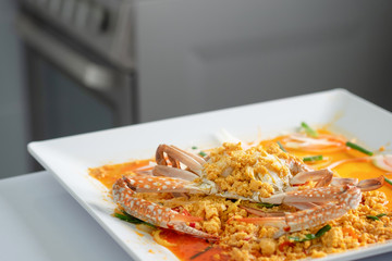 Crab with curry on dish.