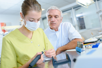 ental technician in process of making dentures