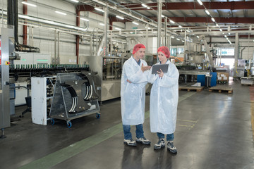 Two people in factory