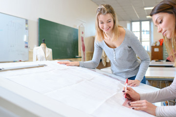 fashion designers working in the studio
