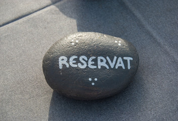 One beach stone with reserved inscription above