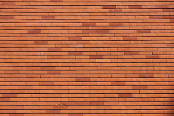 Fototapeta premium Background of old vintage dirty brick wall with peeling plaster, texture