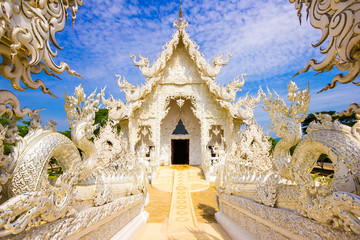Beautiful snowy white temple Wat Rong Khun temple in Chiang Rai, Thailand in Asia