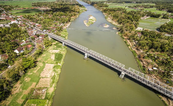 Aerial photo of long bridge cross Opak river at Kretek village, South Yogyakarta, Indonesia