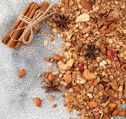 Organic homemade Granola Cereal with oats, almond, anise and cinnamon. Texture oatmeal granola or muesli as background. Top view or flat-lay. Copy space for text.