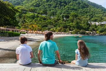Father with kids at beach © TravelPhotoBloggers
