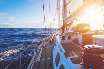 luxury sailboat sailing in sunset sea, yacht cruise