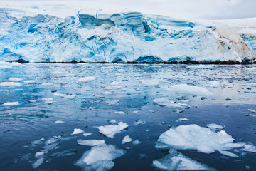 iceberg melting in Antarctica, beautiful nature landscape with glacier and ice in water, global warming