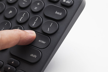 Finger pressing enter key