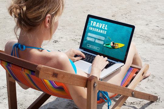 travel insurance online concept, tourist looking at the screen of computer
