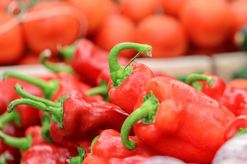 Red bell peppers background close up
