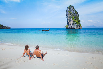 travel to Thailand, honeymoon family couple enjoying sunbath and sea on paradise beach, holiday...