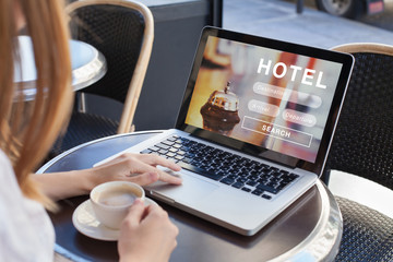 Fototapeta booking hotel on internet, travel planning, online reservation concept, woman looking at screen of computer searching  accommodation obraz