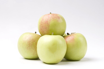 A set of green apples on a white isolated background. An Apple.