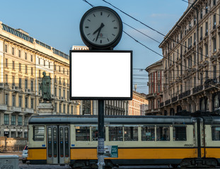 Fototapeta premium blank billboard clock time mock up in milano city center