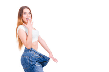 Slim woman back with huge pants and tape isolated on white background.