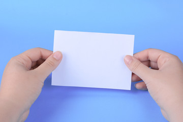 Fototapeta premium Woman hands holding empty note paper