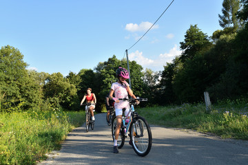 Fototapeta premium Family to bike on the field road for sport activity