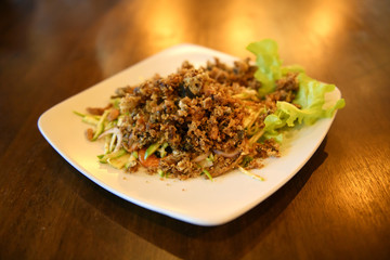 Crispy catfish salad with green mango, Delicious food to eat with sticky rice in the country, Thailand