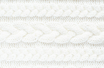 Fototapeta na wymiar Knitted warm white winter sweater. Huggy style