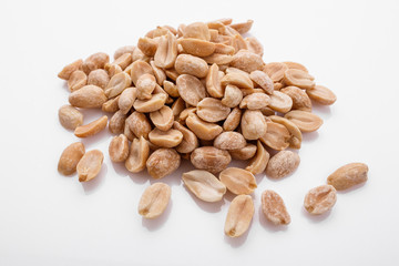 fresh peanuts on a white acrylic background