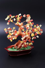 Subject shooting of a fantastic tree from red and yellow crystals.