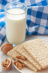 Fresh milk with crunchy oatmeal breads and walnuts