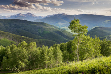 This beautiful view of a summer sunset from the summit of Vail Ski Mountain in Colorado illustrates the majestic scenery you'll find in this popular vacation destination.