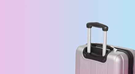 Colorful horizontal banner with suitcase and copyspace. Travelling concept.